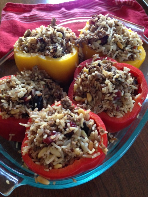 Middle Eastern-inspired stuffed peppers with lamb, rice and dried fruit.