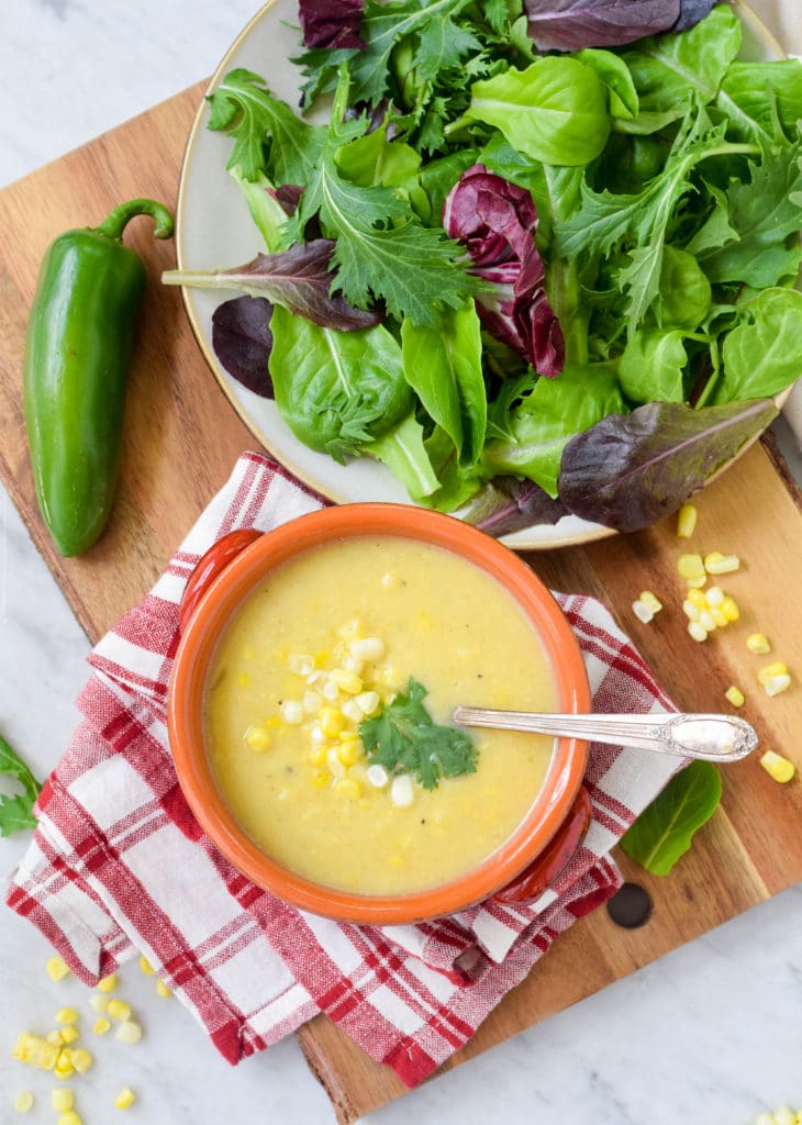 summer soup and salad with vegan corn chowder